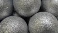 Metallic balls. Silver balls with sparkles. Festive background o