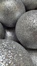 Metallic balls. Silver balls with sparkles. Festive background o