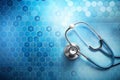 A metallic-blue stethoscope rests on a vibrant blue hexagonal me Royalty Free Stock Photo