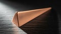 Shaped object rests on a textured dark surface emphasized by dramatic Royalty Free Stock Photo