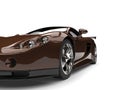 Metallic brown modern fast super car - front view closeup cut shot