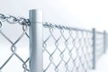 Metallic Chain Link Fence with Silver Posts and Blurred Background in Soft Natural Light Royalty Free Stock Photo