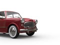 Metallic cherry red vintage small compact car - closeup cut shot Royalty Free Stock Photo