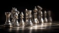 Metallic chess pieces capture dramatic lighting on the board, showcasing artistry and strategy in a captivating moment Royalty Free Stock Photo
