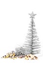 Metallic christmas tree, gift box and cookies on white snow Royalty Free Stock Photo