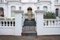 Metallic closed entrance of beautiful white Edwardian house