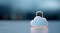 Metallic cloud-shaped padlock symbolizing digital cloud security and data protection on reflective surface with blurred blue Royalty Free Stock Photo