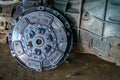 Metallic clutch expire on background gear transmission. Royalty Free Stock Photo