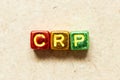 Metallic alphabet letter block in word CRP abbreviation of C-Reactive Protein Test on wood background Royalty Free Stock Photo