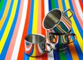 Metallic Cups on Striped Background