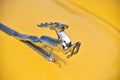 Metallic deer on the hood of an old car Royalty Free Stock Photo