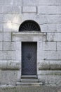 The metallic door of The Bell Tower of Parish Church Santi Filippo e Giacomo Apostoli in Cortina d`Ampezzo.