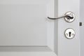 Metallic door knob on a classic white door. Home Royalty Free Stock Photo