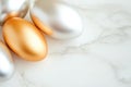 Metallic easter eggs in gold, silver, and bronze on marble surface for elegant holiday decor Royalty Free Stock Photo