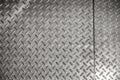 Metallic floor with corrugated surface