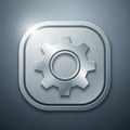 A metallic gear icon with a polished, three-dimensional appearance against a gradient Royalty Free Stock Photo