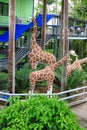 Metallic giraffe statue in garden