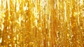 Metallic gold foil tinsel fringe decoration curtain. Royalty Free Stock Photo