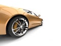 Metallic gold modern luxury sports car - rear wheel closeup shot Royalty Free Stock Photo