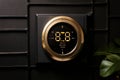 metallic gold round smart thermostat adding luxurious touch to m
