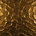 Metallic gold textured surface with irregular, overlapping, pebble-like patterns. The Royalty Free Stock Photo