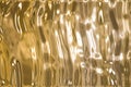 Metallic gold wavy background Royalty Free Stock Photo
