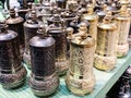 Metallic and golden herb and spices grinders in a traditional Turkish and Arabic style for kitchenware