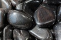 metallic gray tumbled hematite gemstone as mineral rock