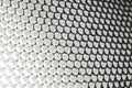 Metallic grid with round elements with Bokeh effect, abstract background, white light Royalty Free Stock Photo