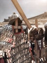 Metallic helmet, brilliant plate armor, sword against the background of ancient fortress wall, ancient Roman armor