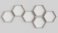 Metallic hexagon blank photo frames mockup hanging on interior wall. Hexagonal pictures on painted surface. 3D rendering Royalty Free Stock Photo