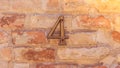 Metallic house number plate 4 four Royalty Free Stock Photo