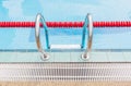 The metallic ladder for using entrance to swimming pool.