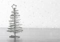 Metallic modern christmas tree on wood table Royalty Free Stock Photo