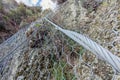 Metallic net holding for hanging rocks falling protection