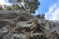 Metallic net holding for hanging rocks falling protection Royalty Free Stock Photo