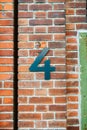 Metallic number four on a vintage brick wall Royalty Free Stock Photo