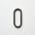 A metallic oblong chain link lies on a white surface. It has a smooth, polished finish, Royalty Free Stock Photo