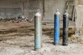 Metallic oxygen gas cylinders on abandoned industrial area Royalty Free Stock Photo