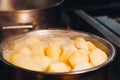 Metallic pan full inside of potato for soup.