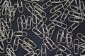 Metallic paper clips silver color black background