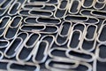 Metallic paper clips silver color black background