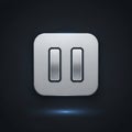 A metallic pause button icon is set against a dark background. The button features a brushed metal Royalty Free Stock Photo