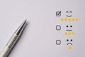 Metallic pen lay down after do customer satisfaction survey  , questionnaire concept Royalty Free Stock Photo