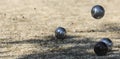 Metallic petanque three balls and a small wood jack