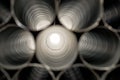Metallic Pipes stacked in rows pattern Royalty Free Stock Photo