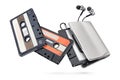 Metallic portable player with earbuds and cassette tape isolated