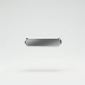 A metallic, rectangular button with rounded edges, suspended against a plain white