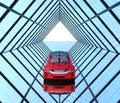 Metallic red car on triangulate shape background