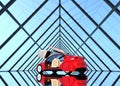 Metallic red car on triangulate shape background